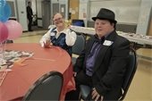 Two guests at Livonia AIR Spring Dance in formal wear