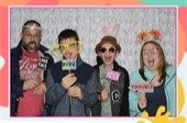 A family with props in a photo booth