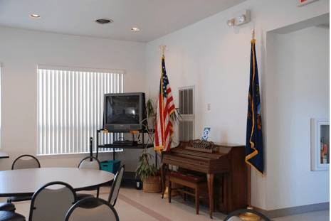 Television and piano in dining area