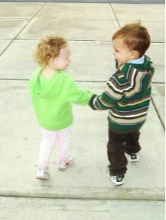 Two Children Holding Hands