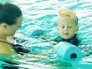 Boy Recieving Swimming Lesson
